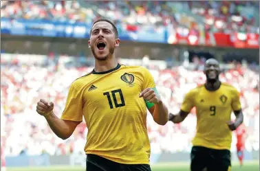  ?? CARL RECINE / REUTERS ?? Belgium's Eden Hazard celebrates scoring his team’s fourth goal in Saturday’s 5-2 romp over Tunisia at Spartak Stadium in Moscow. Belgium leads the World Cup with eight goals in its first two matches.