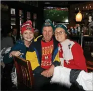  ?? NICHOLAS BUONANNO- NBUONANNO@TROYRECORD.COM ?? Pictured during the 11th annual Ugly Sweater Pub Crawl on Saturday, from left, Kelly Cosgriff, Rob Cosgriff and Lauren Cosgriff.