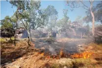  ??  ?? Cultural knowledge merges with 21st-century technology during a controlled burn by Aboriginal rangers at Fish River in the NT (above) and the Arnhem Land plateau (right).