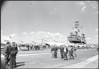  ?? ALEXANDER TURNBULL LIBRARY ?? Civilians on the flight deck during a tour of the ship during its stay in Wellington.