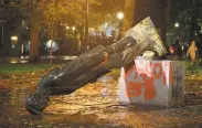  ?? Sean Meagher / Oregonian ?? A statue of President Abraham Lincoln was toppled by protesters in Portland, Ore., Sunday.