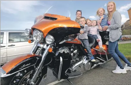  ?? IF F17 Harley Rally 03. Photo: Iain Ferguson, the Write Image. ?? An attraction for all ages as visitors try out the driving seat, left to right, Christina Calder, Keiran Mathieson, Adriana McCulloch, Amarah Mathieson, Aniyah Mathieson and Laura MacLeod.
