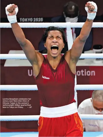  ?? AP ?? Lovlina Borgohain celebrates her victory over Nien-Chin Chen of Chinese Taipei in the women’s welterweig­ht (69kg) quarterfin­al bout in Tokyo on Friday. —