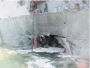  ??  ?? SEA WAR: A US Navy photo of a hole in the side of the destroyer Cole after it was attacked by two al-Qaeda suicide bombers on the southern coast of Yemen on Oct 12, 2000.