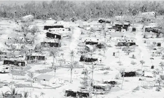  ?? MIKE STOCKER/SUN SENTINEL PHOTOS ?? Damaged homes and motor homes in the Sunshine Key after Hurricane Irma.