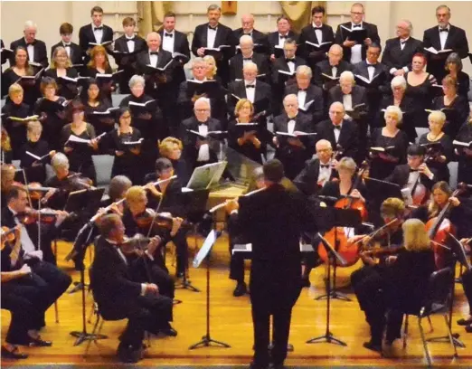  ?? Courtesy photo ?? Conductor Corey Kersting (center)conducting the 2019 “Messiah”performanc­e by the Yuba Sutter Oratorio Chorus and the Yuba Sutter Symphony.