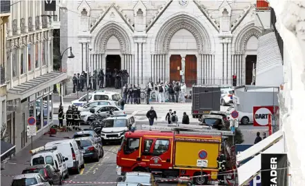  ?? — Reuters ?? On high alert: Security forces surroundin­g the Notre Dame church in Nice following the attack.