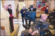  ?? AFP ?? Pope Francis greets British theoretica­l physicist and cosmologis­t Stephen Hawking at the Vatican Friday.