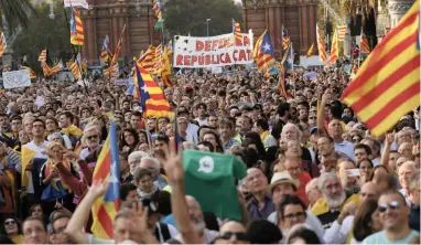  ?? PICTURE: AP ?? WANTING OUT: People with Catalan flags during a rally in Barcelona earlier this week.