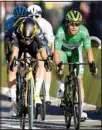  ??  ?? Belgium’s Wout Van Aert (left), crosses the finish line to win ahead of Britain’s Mark Cavendish. (AP)