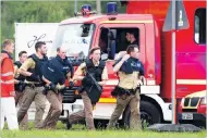  ?? PICTURE: EPA ?? Police officers rush to the Munich shopping centre where a shooting was reported.