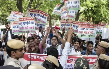  ?? — PTI ?? Nationalis­t Youth Congress activists protest against the BJP at Parliament Street in New Delhi on Tuesday.