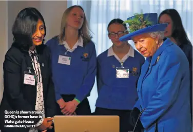  ?? HANNAH McKAY/GETTY ?? Queen is shown around GCHQ’s former base in Watergate House