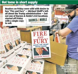  ??  ?? A worker at indie retailer Book Culture in Manhattan (pictured) sets up the store’s display on Friday.