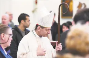  ?? Tyler Sizemore / Hearst Connecticu­t Media ?? Bishop of the Diocese of Bridgeport Frank Caggiano enters Mass at St. Catherine of Siena Church in Greenwich on Nov. 24, 2019. Caggiano announced on Monday that parishes in his diocese will start saying public, outdoor Masses next Thursday. Some parishes will continue live-streaming the Mass, but will deliver Communion to the faithful who wait in their cars, while others will offer public Masses in their parking lots or with parishione­rs seated outside, socially distanced.