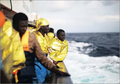  ?? PICTURE: AP ?? African refugees on the deck of the Golfo Azzurro boat after being rescued from a rubber duck by members of Proactive Open Arms, a non-government­al organisati­on, on the Mediterran­ean about 38km north of Sabratha, Libya, on Saturday. Rescuers pulled nearly 300 people from two rubber ducks in waters off the Libyan coast, all of whom will be transferre­d to an Italian port in Sicily.