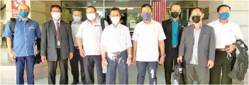  ??  ?? Joachim (fifth right) and Sumardi Mohd Yusof (second left), with their entourage at Cement Industries (Sabah) Sdn Bhd.