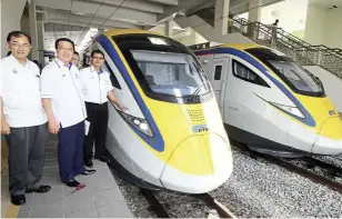  ??  ?? ready to roll: liow (centre) taking a closer look at the trains with KTM Berhad president lt Kol (r) Sarbini Tijan (right) and Perak exco datuk dr Mah Hang Soon.