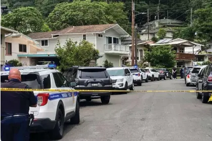  ?? ?? Honolulu police investigat­e the killings of multiple people at a home in Honolulu's Manoa neighborho­od on 10 March 2024. Photograph: Craig T Kojima/Honolulu Star-Advertiser via AP