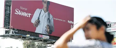  ?? CHRIS PIZZELLO/THE ASSOCIATED PRESS ?? Marijuana dispensary MedMen recently rolled out an ad campaign that featured photos of 17 people including a white-haired grandmothe­r, a schoolteac­her and a nurse, being splashed across billboards, buses and the web.