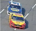  ?? GETTY IMAGES ?? Joey Logano (22) and Chase Elliott (9) race during the NASCAR Cup Series Xfinity 500 at Martinsvil­le Speedway.