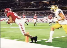  ?? Michael Ainsworth / Associated Press ?? Alabama wide receiver DeVonta Smith catches a pass in the end zone for a touchdown as Notre Dame cornerback Nick McCloud, right, defends in the Rose Bowl on Friday.