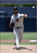  ?? ORLANDO RAMIREZ — THE ASSOCIATED PRESS ?? San Francisco Giants starting pitcher Madison Bumgarner works against a San Diego Padres batter during the first inning of a baseball game Sunday in San Diego.