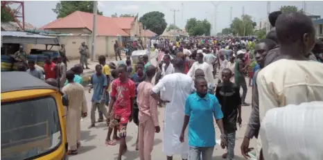  ?? Photo: Olatunji Omirin ?? Commercial tricycle drivers protest over alleged extortions by the police at the Dandal Divisional Police Station in Maiduguri yesterday.