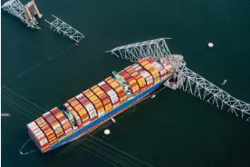  ?? ?? The Dali container vessel after striking the Francis Scott Key Bridge in Baltimore on 26 March 2024. Photograph: Al Drago/Bloomberg via Getty Images