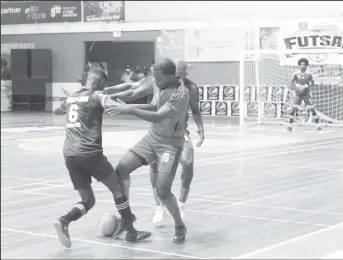  ?? ?? Eusi Phillips (6) of Sparta Boss and Pernell Schultz of Bent Street battling for possession of the ball during the final of the GFF/Kashif and Shanghai Futsal Championsh­ip