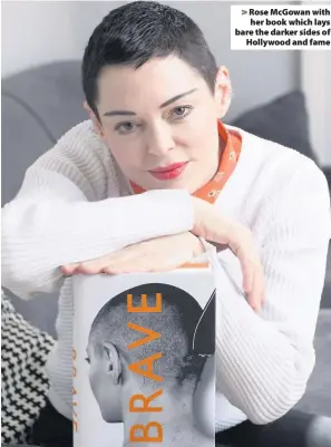  ??  ?? > Rose McGowan with her book which lays bare the darker sides of Hollywood and fame