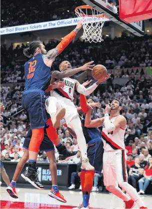  ?? PHOTO: USA TODAY ?? Unstoppabl­e . . . Oklahoma City Thunder centre Steven Adams (left) tries to block the shot of Portland Trail Blazers guard Damian Lillard during game five of their first round NBA playoff series at Moda Centre in Portland yesterday. Portland won 118115, eliminatin­g Oklahoma.