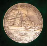  ?? ?? The front of the Pearl Harbor Survivor’s medal depicts the burning ships of Battleship Row