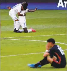  ?? Fernando Llano Associated Press ?? THE SENIOR U.S. team, left, beat Northern Ireland in a friendly Sunday before an under-23 team fell to Honduras in Olympic qualifying.