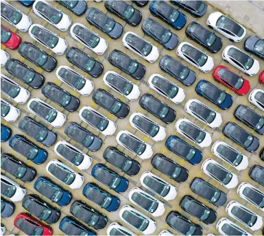  ?? Photo: Getty ?? An aerial view of Tesla electric vehicles at Nangang port. The American car maker announced discounts in October to drive new sales.