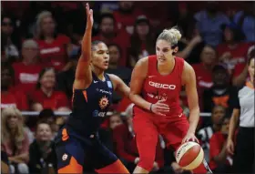  ?? ALEX BRANDON - THE ASSOCIATED PRESS ?? Washington Mystics forward Elena Delle Donne, right, drives against Connecticu­t Sun forward Alyssa Thomas during the first half of Game 5 of basketball’s WNBA Finals, Thursday, Oct. 10, 2019, in Washington.