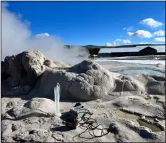  ?? ?? Instrument­s at the site of Old Faithful used to collect water samples from its geyser cone.