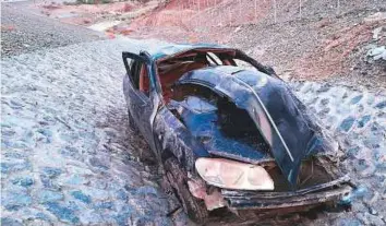  ?? Courtesy: RAK Police ?? The mangled car after falling into the Asafni valley in Ras Al Khaimah on Friday. Police said the Asian man who was driving was tired when the incident happened.