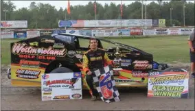  ?? SUBMITTED PHOTO - RANDY MALLETT/UTICA-ROME SPEEDWAY ?? Stewart Friesen poses in front of his car after setting the career record for victories at Utica-Rome Speedway on Sunday, Aug. 18, 2013. The win was Friesen’s 43rd at the track.