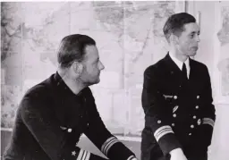  ??  ?? ■ Kapitänleu­tnant Fritz-julius Lemp (CO of U-30) at the left with his engineer officer Hans-joachim Eichelborn.