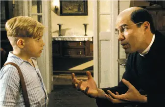  ?? Open Road Films photos ?? Pepper Flynt Busbee ( Jakob Salvati, above left) gets advice from the Rev. Crispin ( Eduardo Verástegui) after his father, James ( Michael Rapaport, left), goes missing while serving in World War II in “Little Boy.”