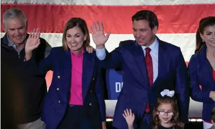  ?? ?? Kim Reynolds and Ron DeSantis wave during a rally in Des Moines, Iowa, on 6 November. Photograph: Bryon Houlgrave/AP