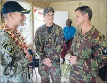  ??  ?? Family affair: Warrant Officer 2 Brendon McDonald, and his nephew, Sapper Chad McDonald with the Pacific Partnershi­p Mission Commander.