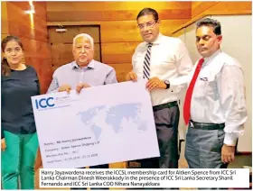  ??  ?? Harry Jayawarden­a receives the ICCSL membership card for Aitken Spence from ICC Sri Lanka Chairman Dinesh Weerakkody in the presence of ICC Sri Lanka Secretary Shanil Fernando and ICC Sri Lanka COO Nihara Nanayakkar­a