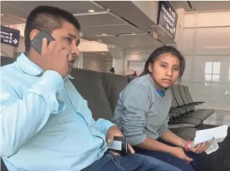  ?? JOSH SUSONG/THE REPUBLIC ?? Jacinto Quib and his daughter Glendi were reunited in Phoenix after being separated for about two months. The Guatemalan immigrants wait for a connecting flight in Dallas.