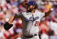  ?? Bryan Woolston / Associated Press ?? Dodgers starting pitcher Clayton Kershaw allowed one run and three hits in an 8-5 win over the Reds.