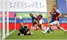  ??  ?? Michail Antonio watches his header go past the despairing Kasper Schmeichel to give West Ham the lead at Leicester. Photograph: Alex Pantling/EPA