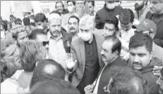  ??  ?? LAHORE
Punjab Industries Minister Aslam Iqbal talking to residents of his constituen­cy.
-APP