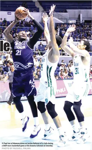  ??  ?? Papi Sarr of Adamson drives on Justine Baltazar of La Salle during a UAAP men’s basketball game at the Araneta Coliseum on Saturday.