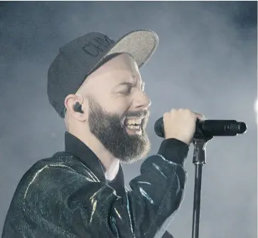  ??  ?? French singer and songwriter Woodkid performs at the opening Place des Festivals outdoor show at the Montreal Internatio­nal Jazz Festival on Thursday.